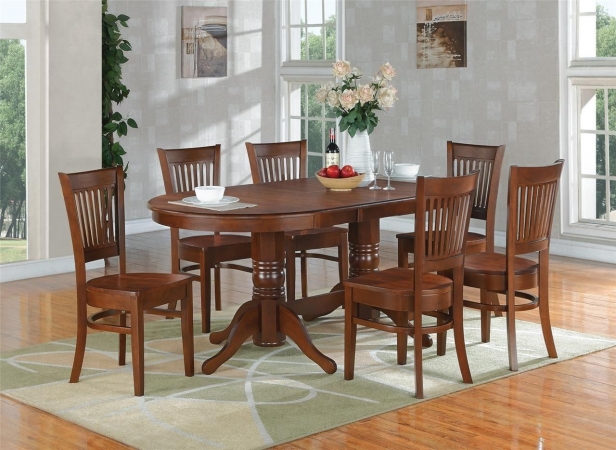 Vancouver 9PC set with double pedestal oval featured 17 in. butterfly leaf and 8 wood seat chairs