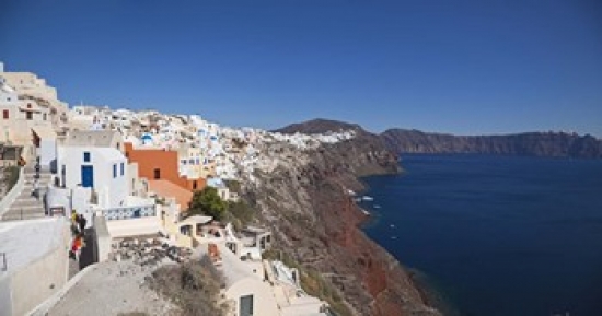 Picture of Panoramic Images PPI122781 High angle view of a town on an island  Oia  Santorini  Cyclades Islands  Greece Poster Print by Panoramic Images - 36 x 19