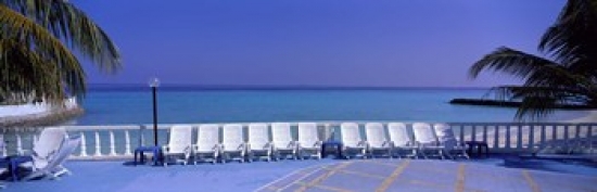 Picture of Panoramic Images PPI82929L Lounge Chairs  Giraavaru  Maldives Poster Print by Panoramic Images - 36 x 12