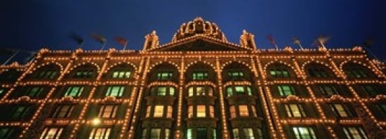 PPI95020L Low angle view of a building lit up at night  Harrods  London  England Poster Print by  - 36 x 12 -  Panoramic Images