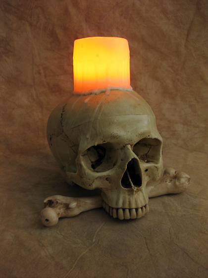 Lighted Skull With Bone & Wax Candle